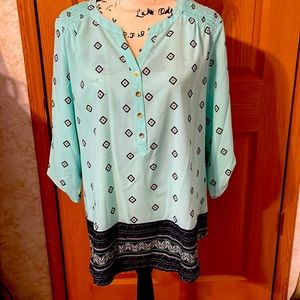 Dressy tunic with 3/4 sleeves with gold buttons on sleeves and 4 on the front